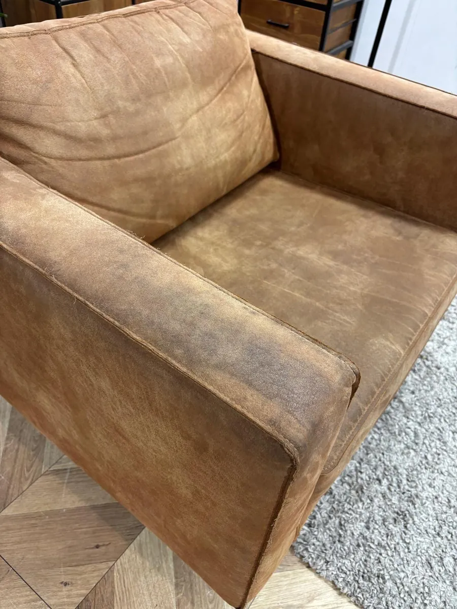 Cognac leather armchair — before cleaning